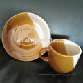 stoneware color glazed cup and saucer